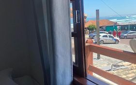 Suites e Quartos Em frente a Praia Grande -Na orla Flavia Alessandra